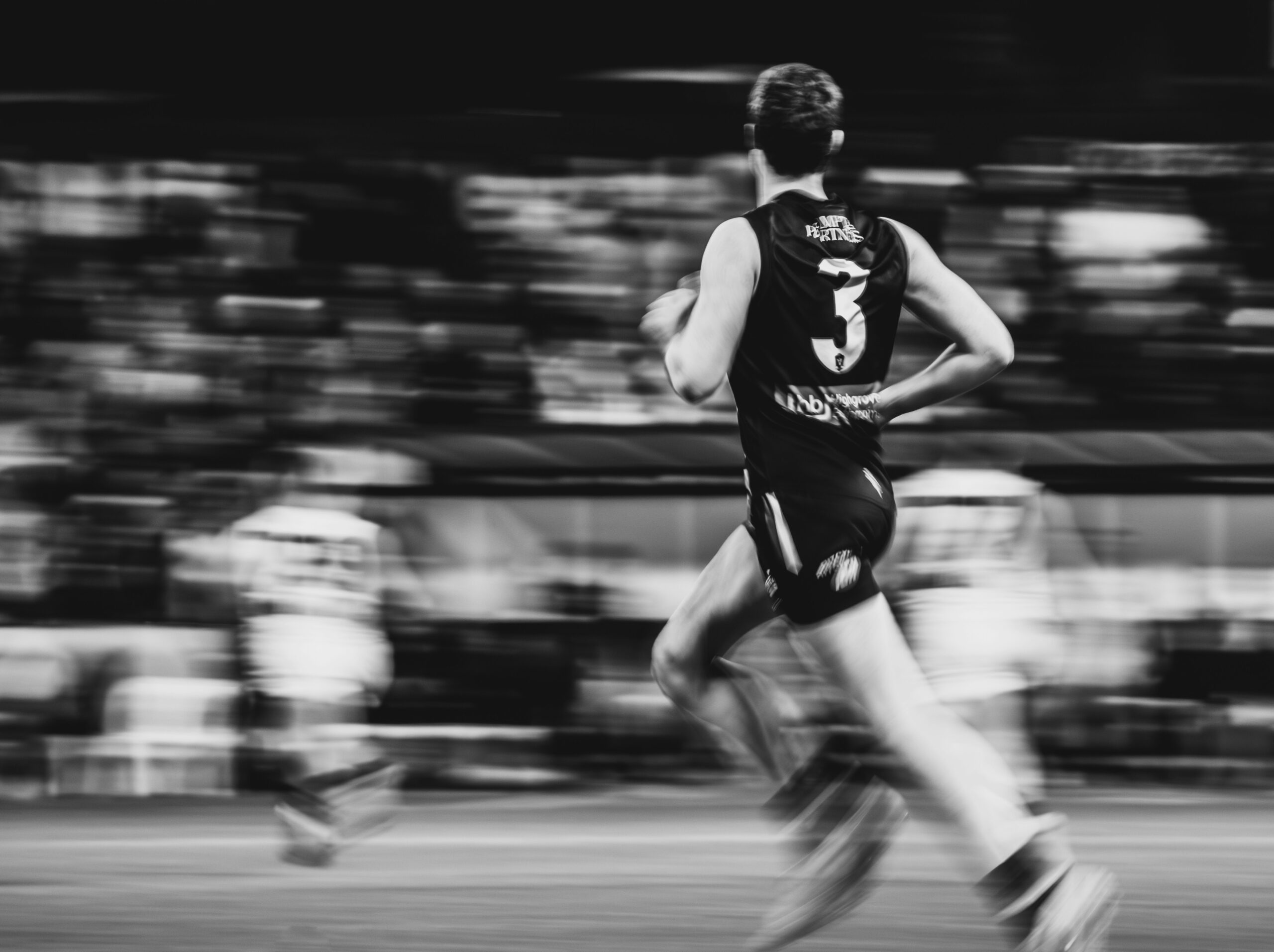 Athlete running at speed during a match